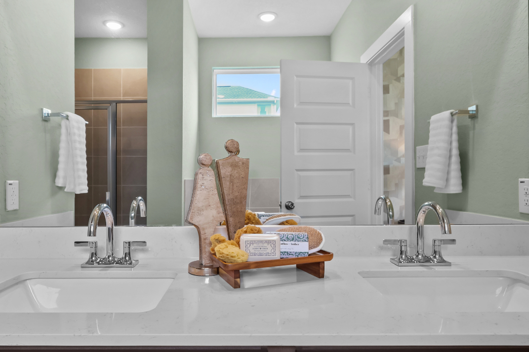A bathroom with a large mirror.