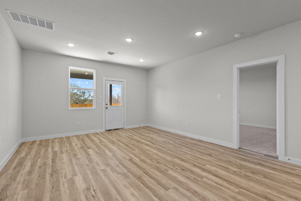 A room with a wood floor and a wood floor.