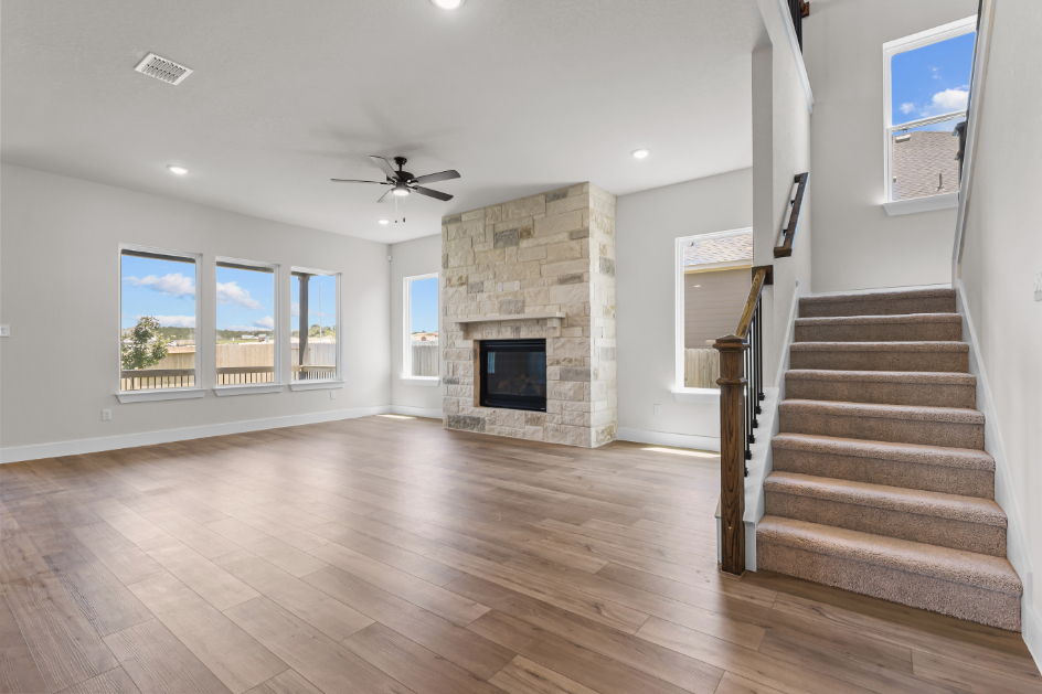 A large living room with a fireplace.