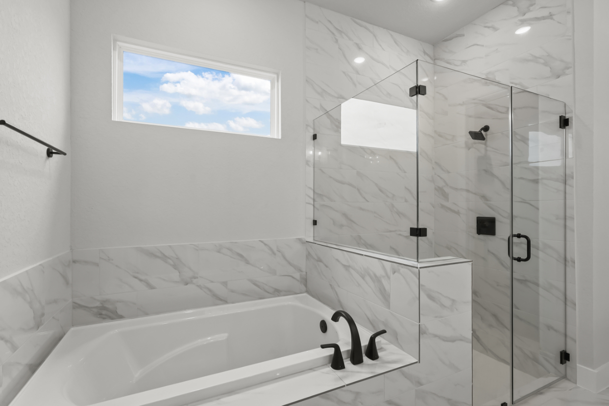 A bathroom with a glass shower.