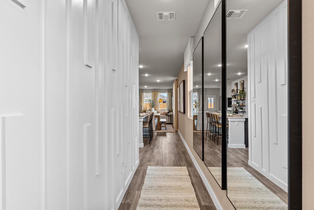 A hallway with white walls.