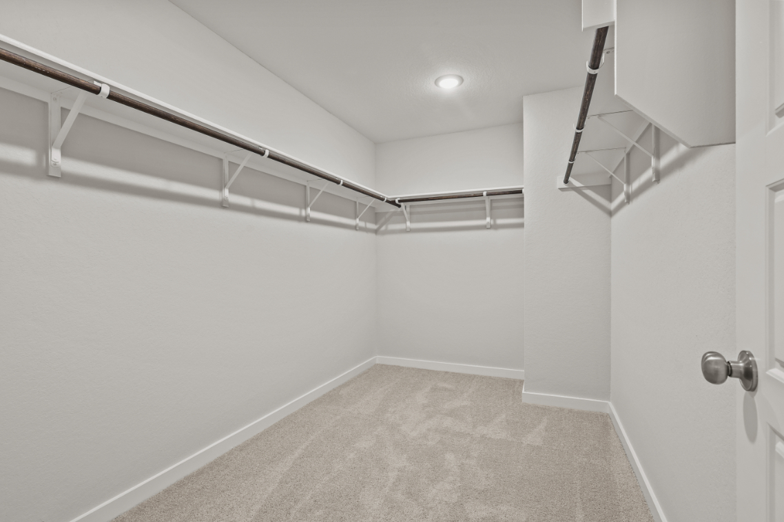 A hallway with white walls.