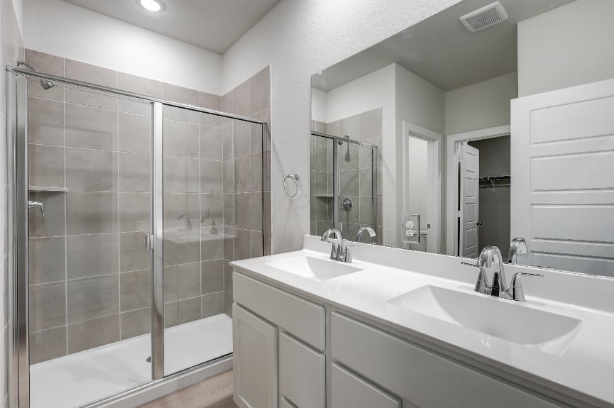 A bathroom with a glass shower.