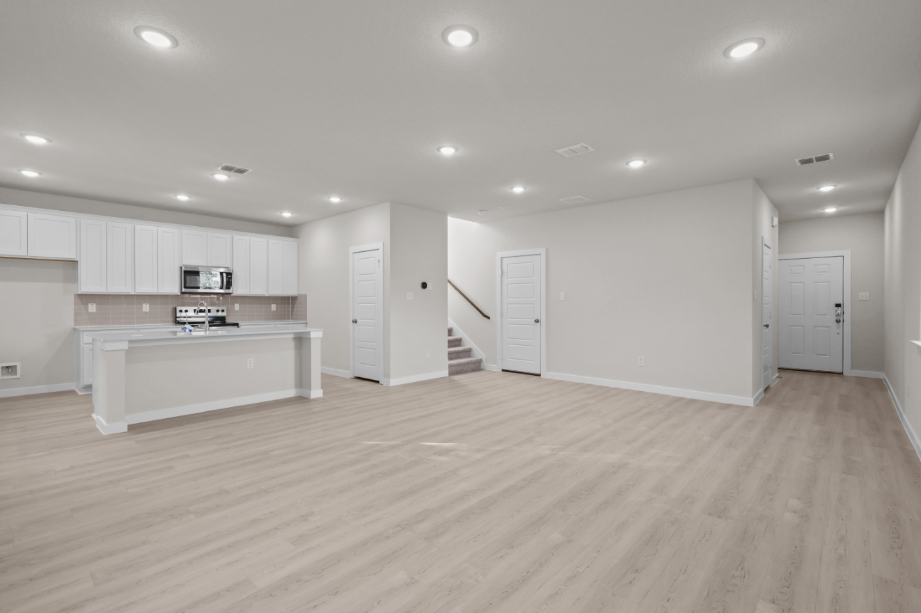 A large kitchen with white cabinets.