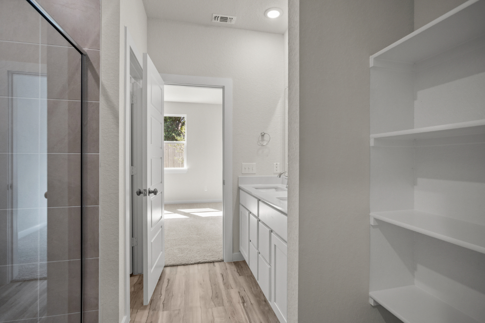 A bathroom with a glass shower.