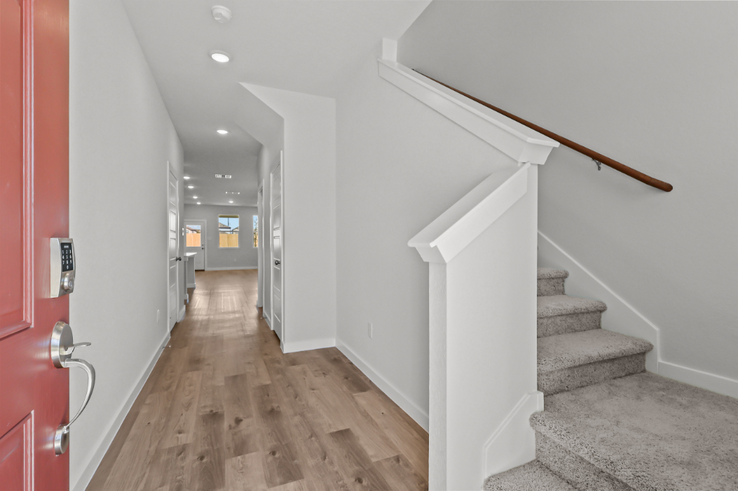 A hallway with white walls.