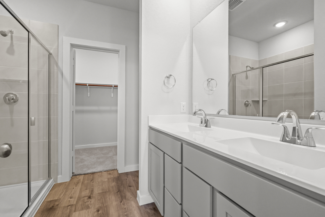 A bathroom with a glass shower.