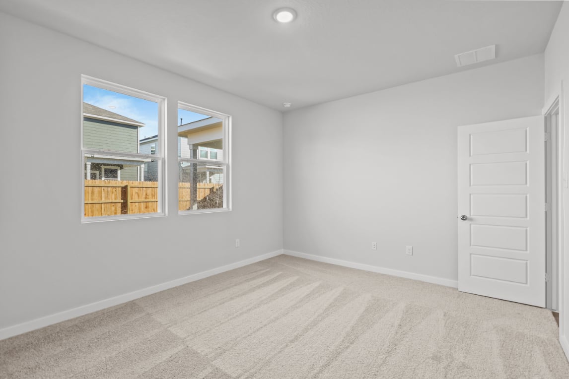 A room with a window and a door.