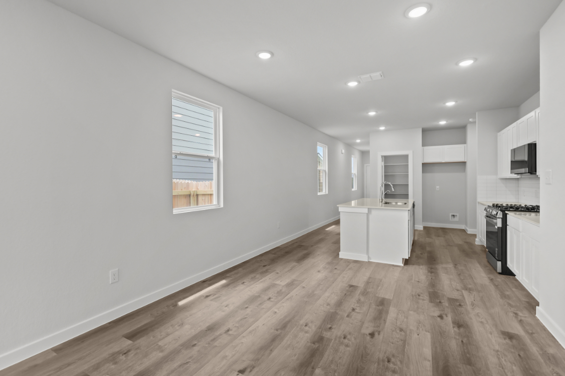 A kitchen with white walls.