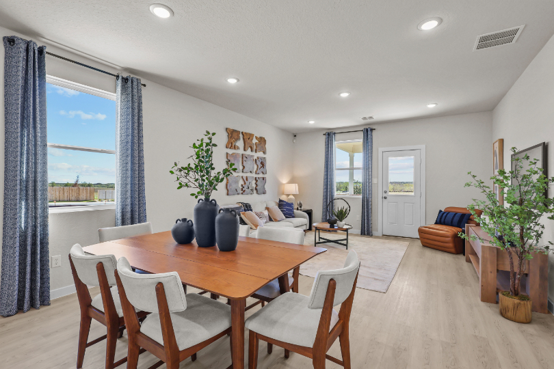 A dining room with a large window.