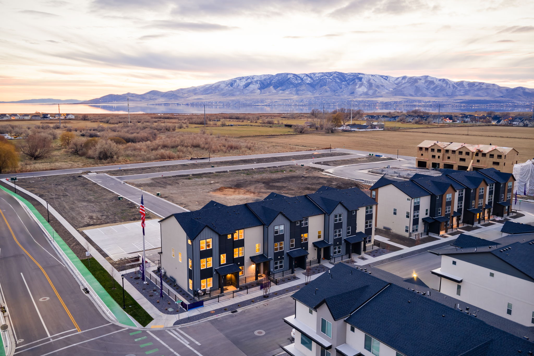 A group of buildings next to a road.