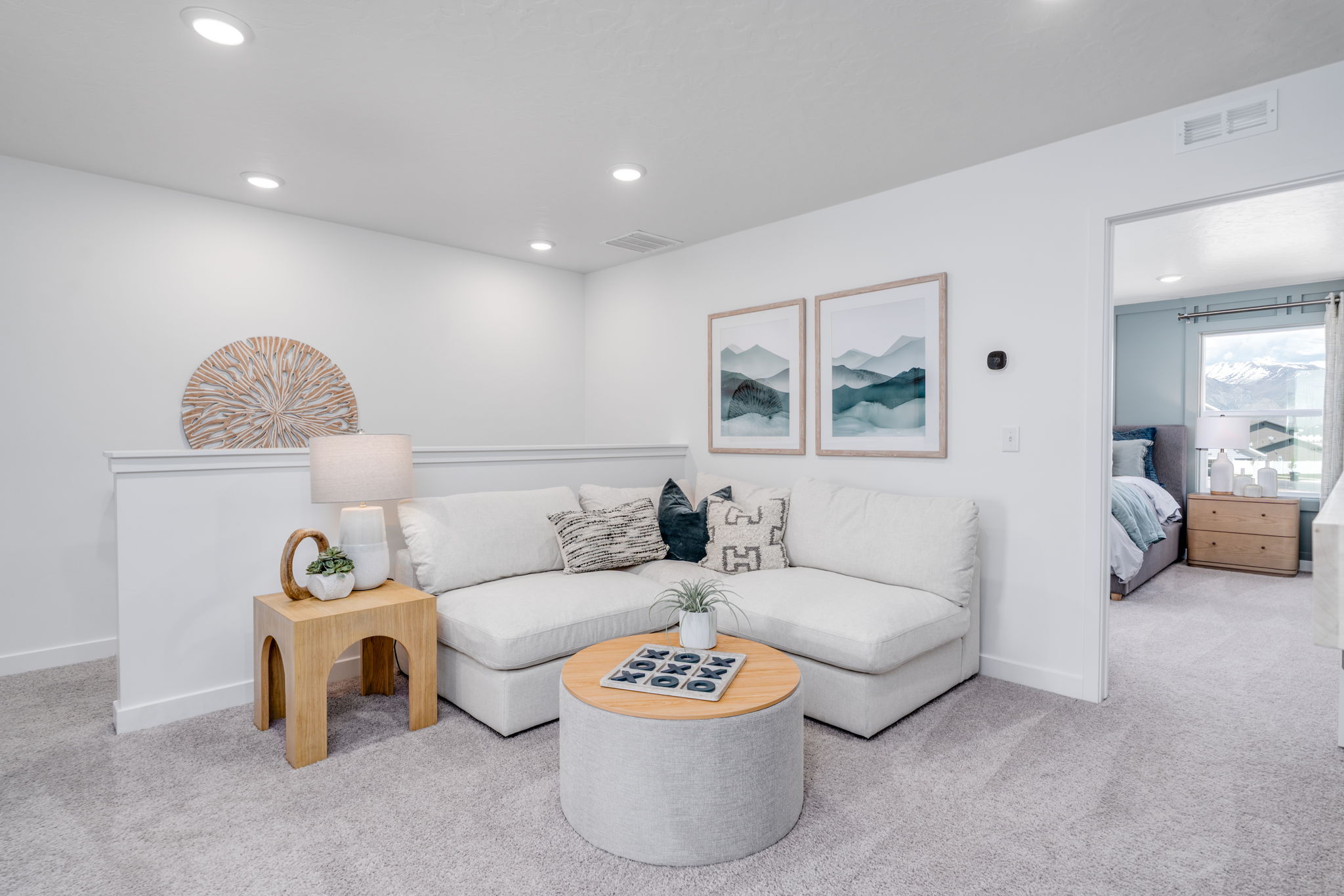 A living room with a white couch.
