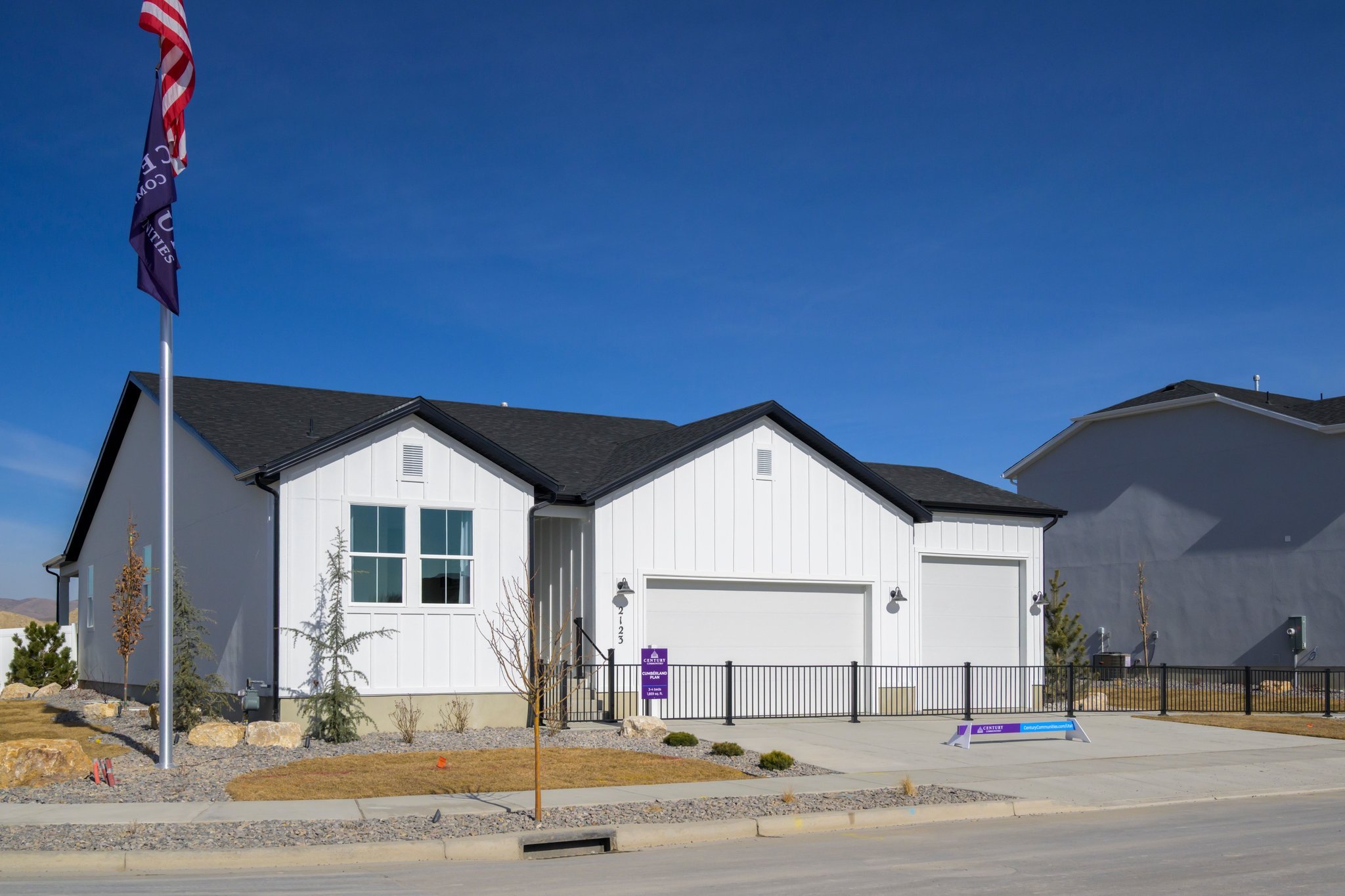 A house with a flag in front.