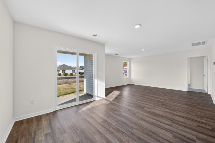 A room with a wood floor and a wood floor.