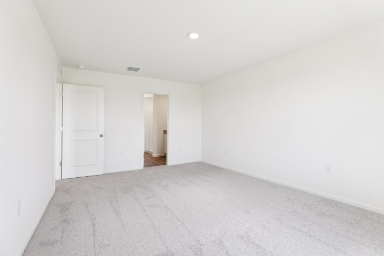 A hallway with white walls.