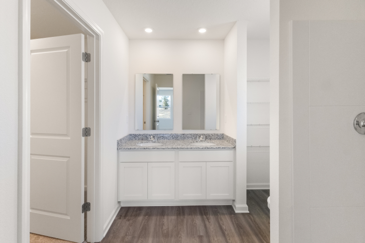 A bathroom with white walls.