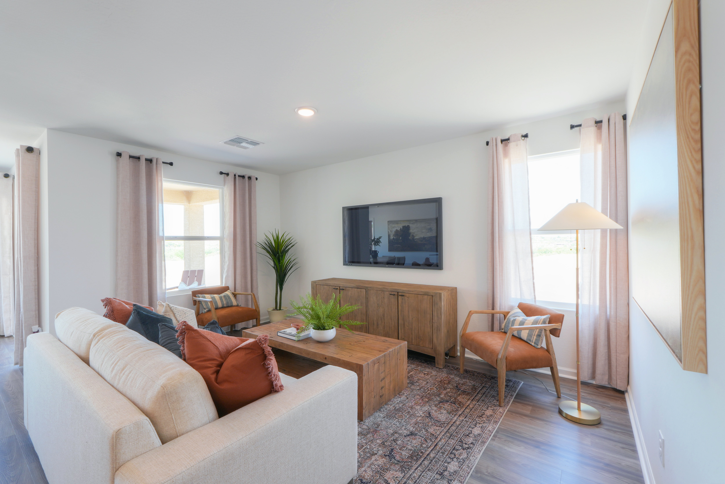 A living room with a tv and couches.