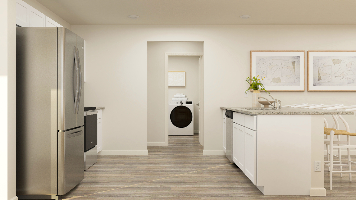 A kitchen with white cabinets.