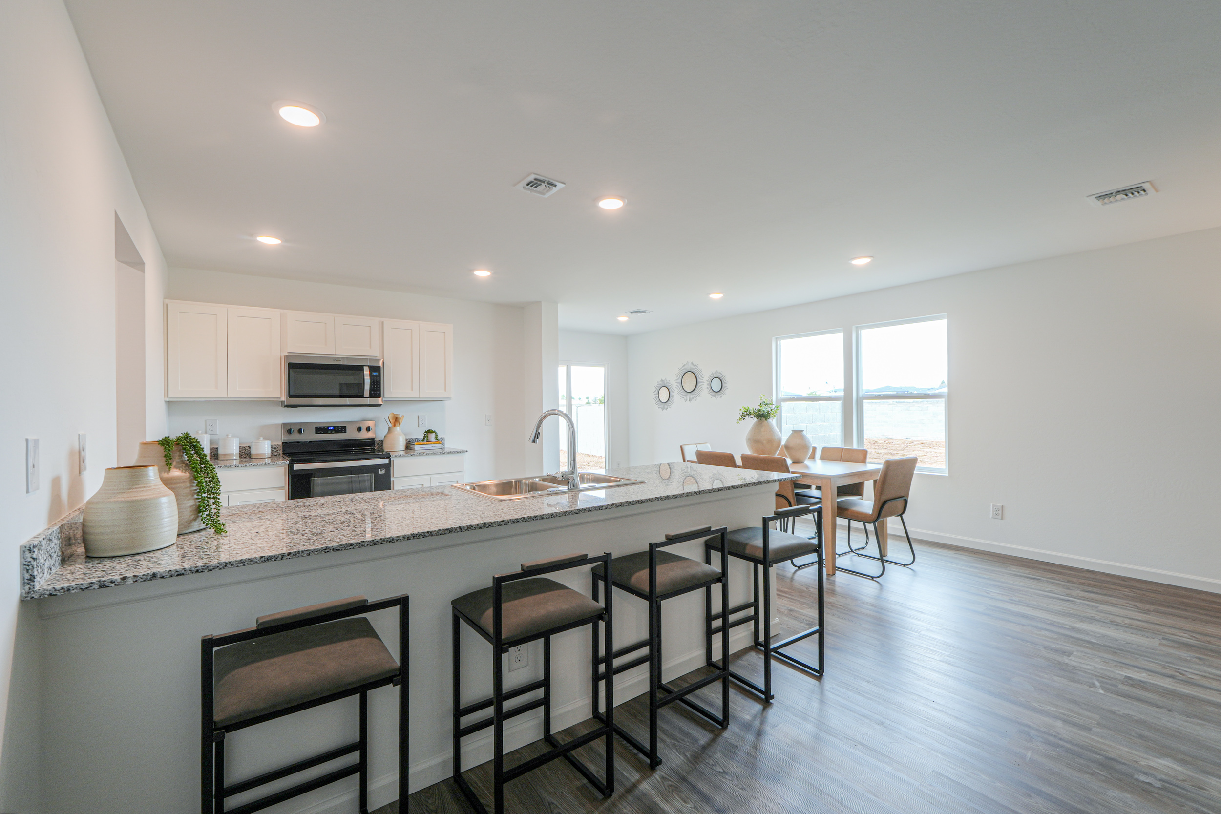 A kitchen with a marble island.
