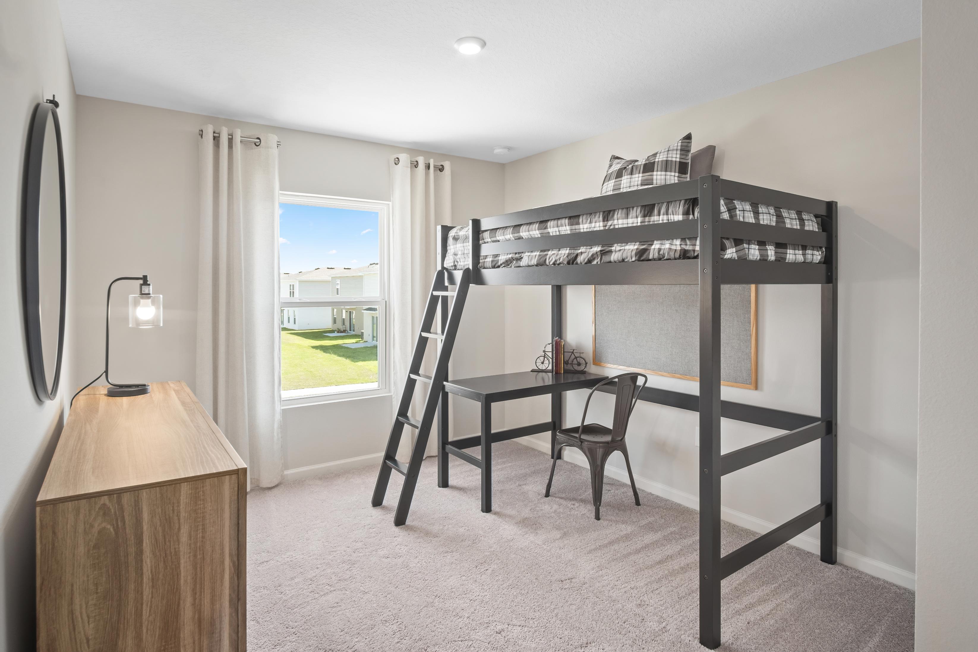 A room with a bed and a table.