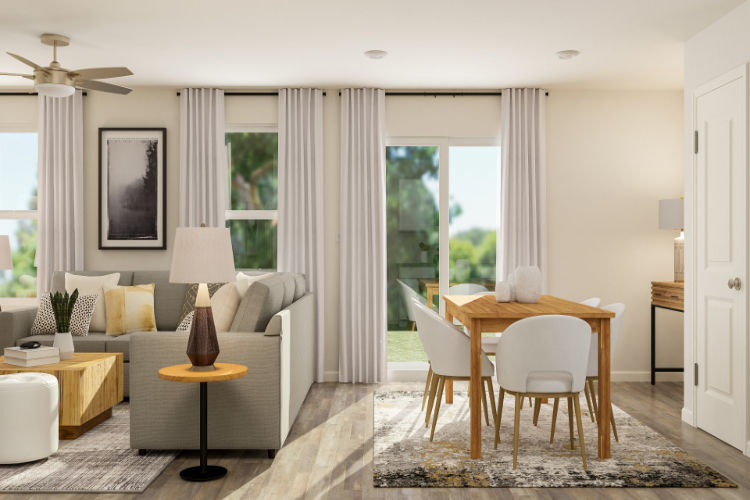 A living room with a table and chairs.