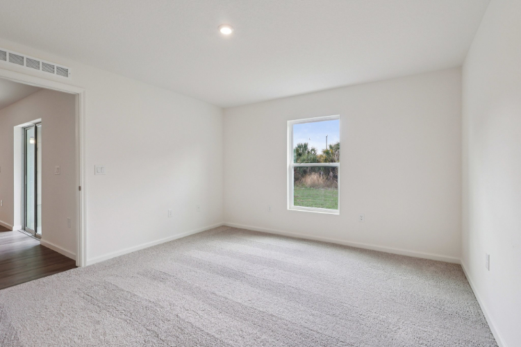 A room with a window and a door.