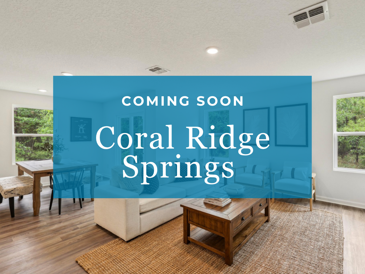 A room with a blue wall and chairs.