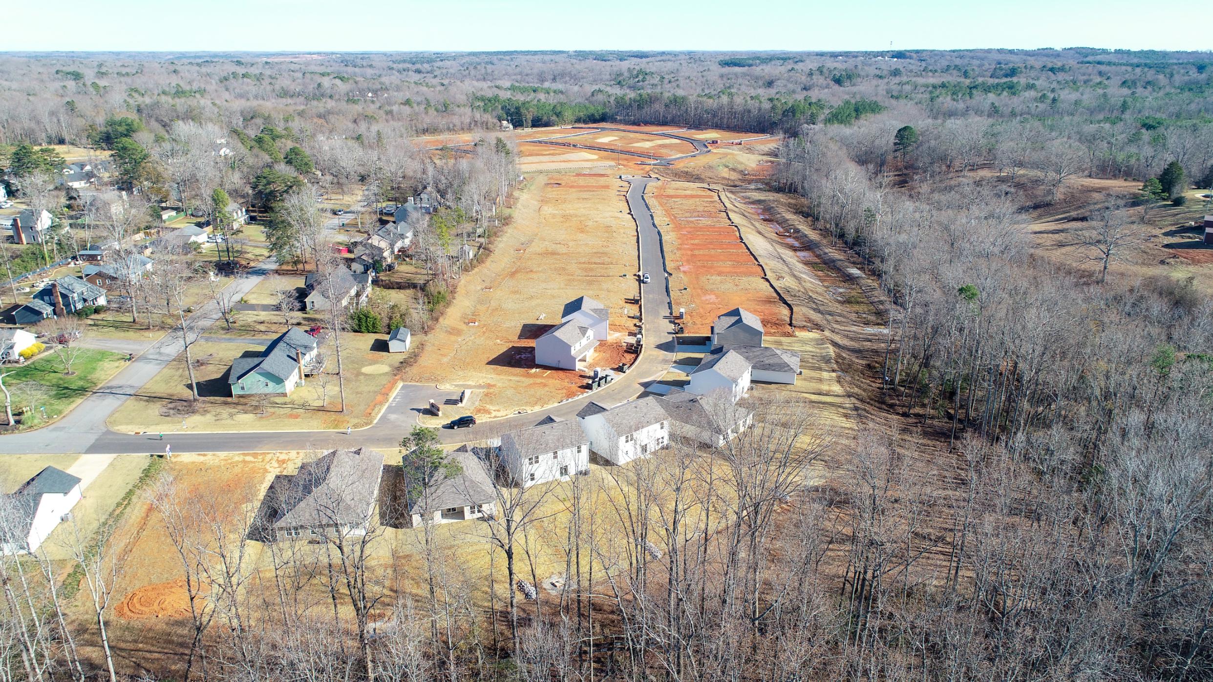 A landscape with houses and trees.