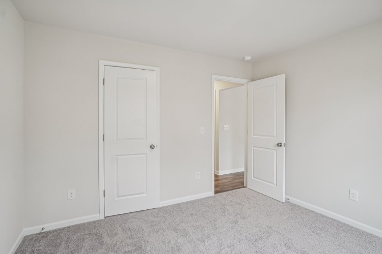A room with white doors.