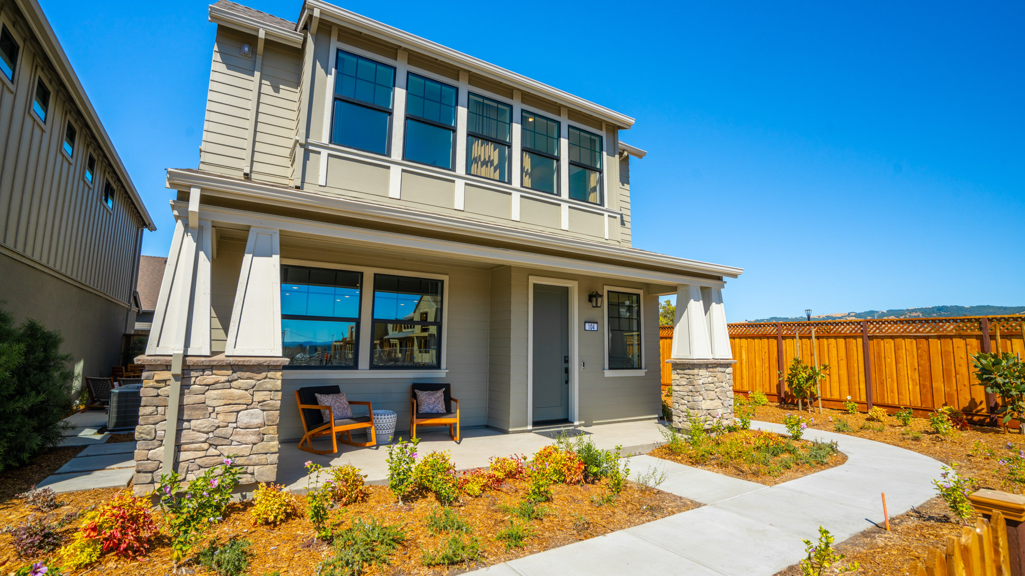 A house with a patio and chairs.